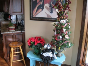 I just about forgot this little cutie, my kitchen tree.  I have a few ornaments for Miss Mouse to view.  