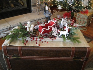 For my coffee table centerpiece, I arranged some coordinating items in a wooden tray.   The coffee table is an old trunk.  