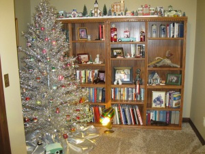 Another view of the tinsel tree.  My village lives on top the book shelf.  