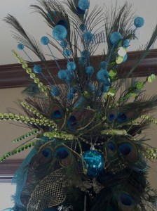 For the peacock tree topper, I used more peacock feathers, and bright green and blue floral stems.